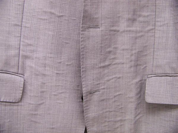 Close-Up of Suit Bubbling Caused by Adhesive Delamination