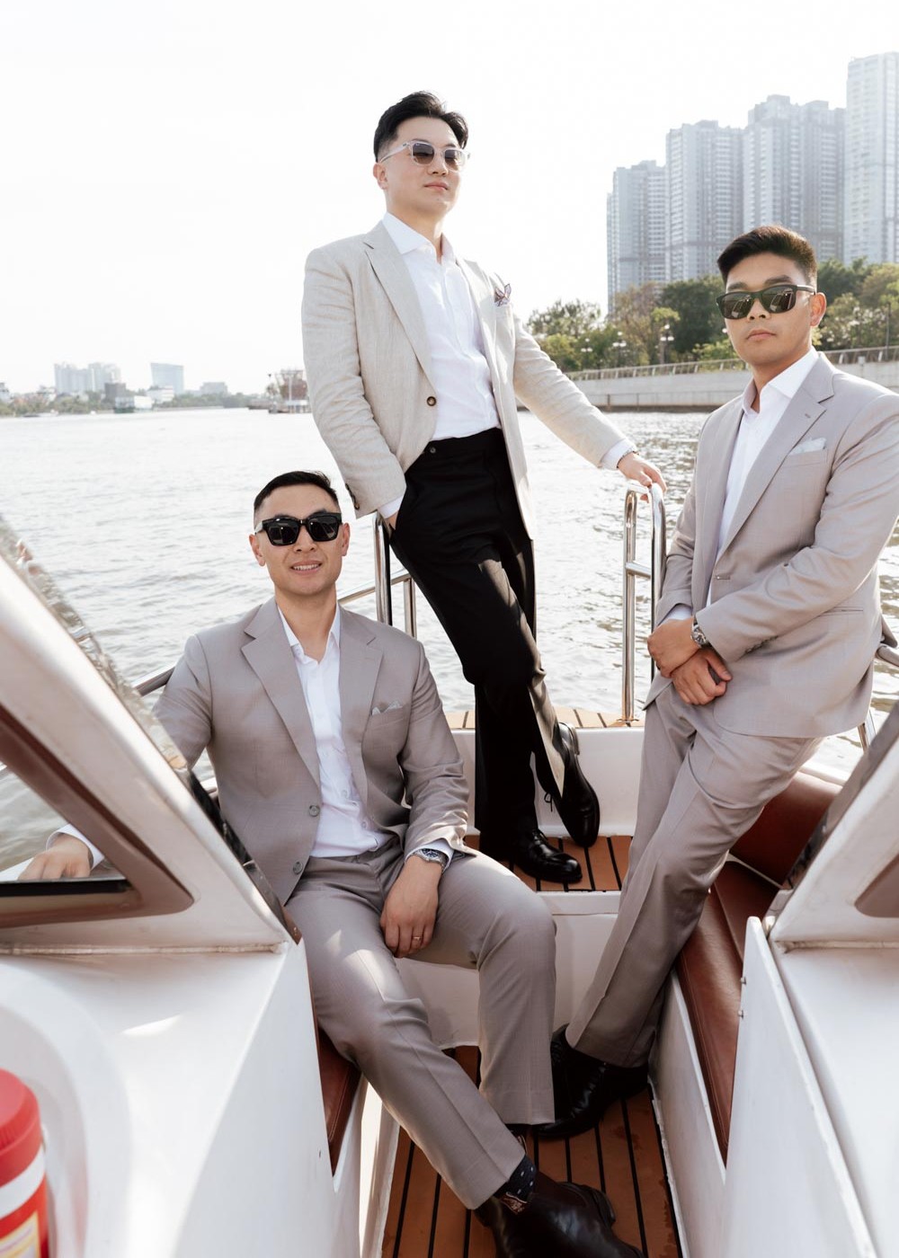 Gentlemen in Bespoke Suits by V.Man Tailor on a Luxury Yacht: Tailored to each gentleman, V.Man Tailor suits bring together refined craftsmanship, modern style, and effortless elegance for sophisticated occasions at sea.