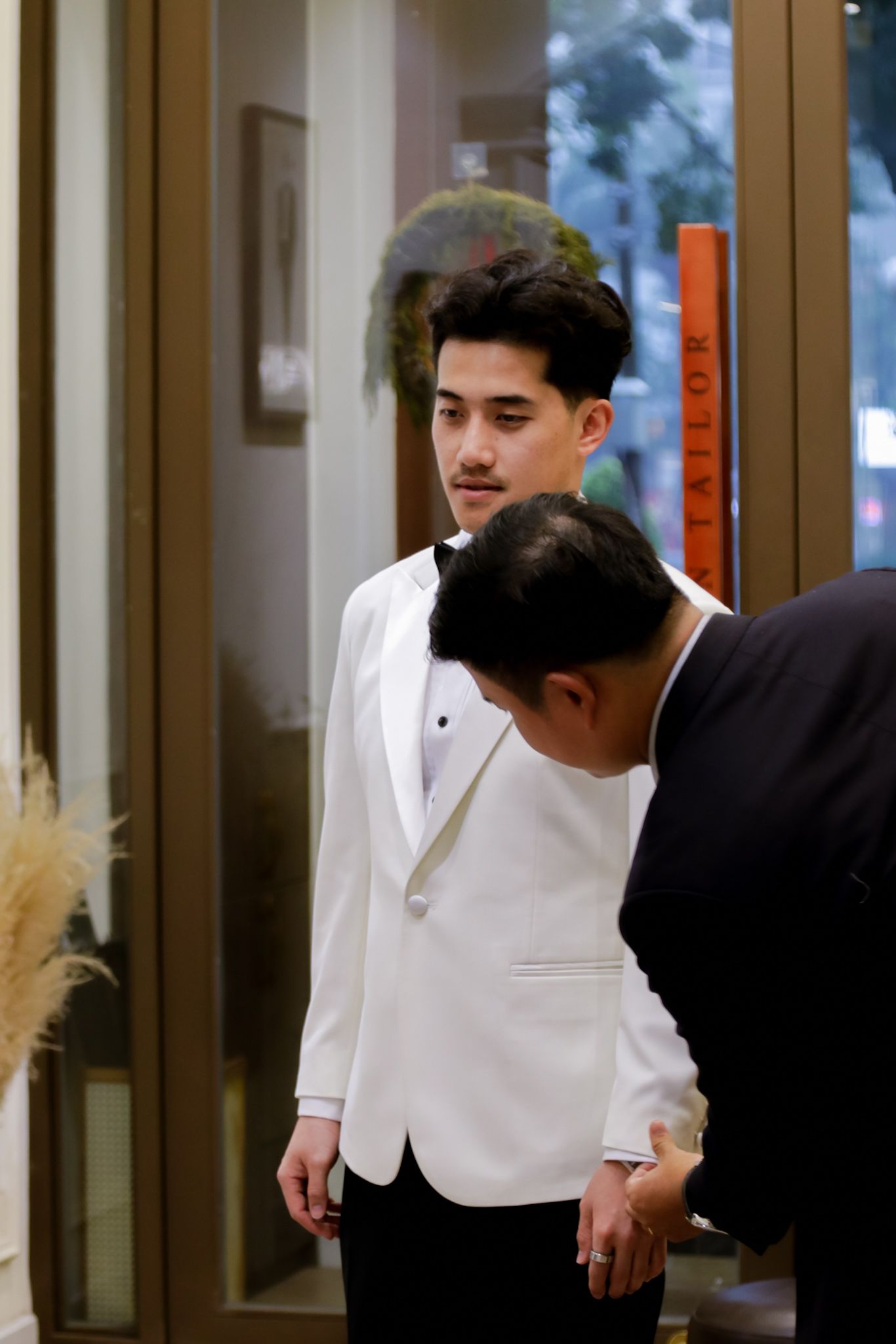 A final 30-minute fitting ensures the finished suit fits perfectly before departure, leaving the groom confident, comfortable, and ready to take his V.Man Tailor suit home.